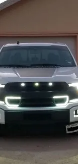 Front view of a white truck with LED lights, perfect for mobile wallpaper.