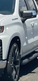 Sleek white pickup truck with chrome accents and stylish design.