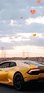 Sleek yellow sports car on desert road under dramatic sky.