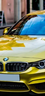 Sleek yellow sports car on city street, radiating luxury and style.