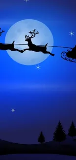 Silhouette of Santa's sleigh flying across a blue moonlit sky.