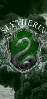 Slytherin emblem on dark green smoky background.