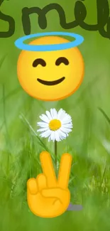 Smile emoji with halo on green grass with daisy and victory sign.