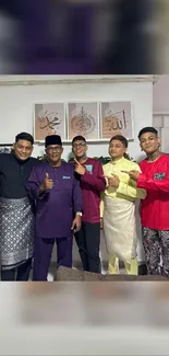 Group of people in traditional clothing smiling and posing indoors.