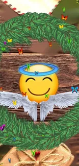 Smiley face angel with wings in a green wreath on wood background.