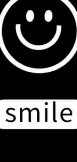 Black wallpaper with a white smiley face and the text "smile".