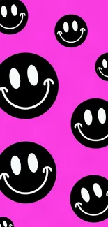 Pink background with black and white smiley faces.