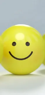 Row of yellow smiley faces displaying various emotions on a light background.