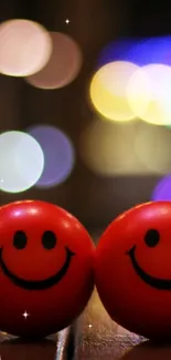 Two red smiley faces on a wooden surface with blurred city lights.