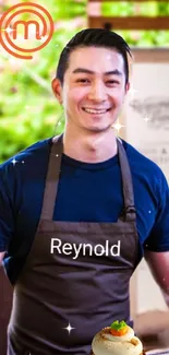 Smiling chef in apron with green backdrop.