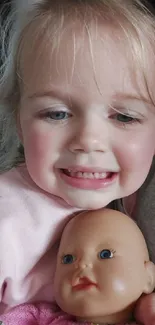 A child joyfully smiles while holding a doll.