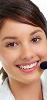 Portrait of a smiling woman wearing a headset, symbolizing customer support.