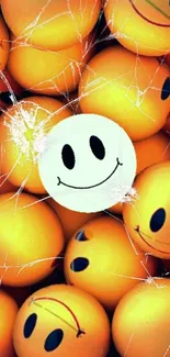 Vibrant mobile wallpaper with smiling emojis and cracked effect.