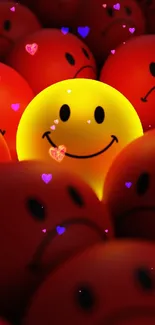 Yellow smiley in a sea of red sad faces on a phone wallpaper.