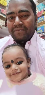 Smiling father and child in a store setting with colorful backgrounds.