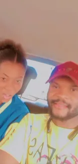 Smiling friends taking a car selfie.