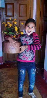 Joyful child holding flowers in a cozy home setting.