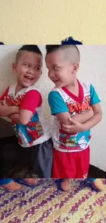 Smiling kids wearing colorful cartoon T-shirts in a fun wallpaper.