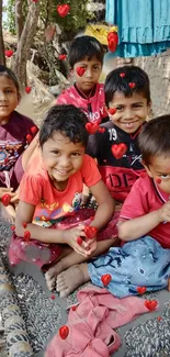 Kids smiling on a cot with floating red hearts.