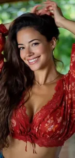 Smiling woman in red floral dress with green background