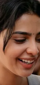 Close-up of smiling woman with vibrant colors.