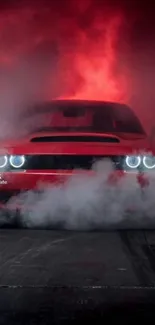 Red sports car emerging from smoke background.