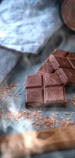 Chocolate squares on a rustic table.