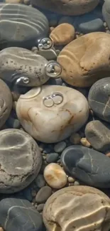 Smooth river stones under clear water with bubbles.