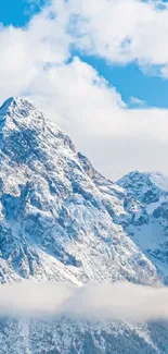 Mobile wallpaper featuring a snow-capped mountain against a vivid blue sky.