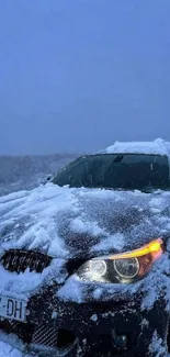 Snow-covered car in a serene winter landscape under blue sky.