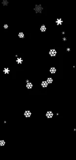 Minimalist mobile wallpaper with white snowflakes on a black background.