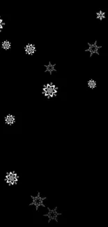 Black wallpaper with scattered white snowflakes for a sleek mobile background.