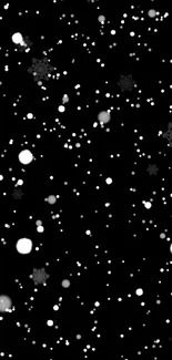 Minimalist black wallpaper with scattered white snowflakes.