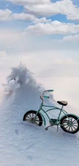 A vintage bicycle on snowy terrain beneath a clouded blue sky.