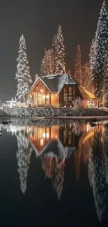 Snowy cabin by a tranquil lake under a starry night sky.