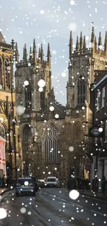 Snowy urban street with a gothic cathedral backdrop.