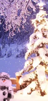 Snowy Christmas tree and snowman at night.