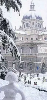 Snowy city scene with historic building and snow sculpture in foreground.