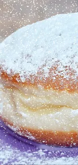 A delightful powdered sugar donut with a snowy effect on a lavender background.