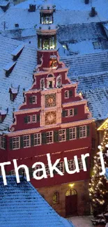 Snowy village with Christmas tree and cozy lights at dusk.