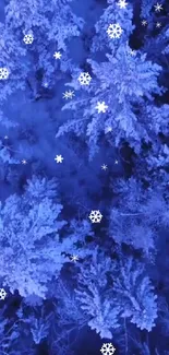 Blue snowy forest with falling snowflakes at night.