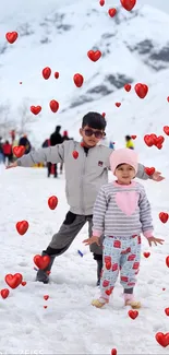 Kids enjoying fun in a snowy mountain landscape.