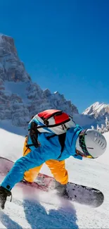 Snowboarder in colorful gear on snowy mountain slope with blue sky.