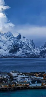 Snowy mountains, lake, and village at dusk mobile wallpaper.