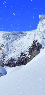 Snowy mountain under a bright blue sky with gentle snowfall.