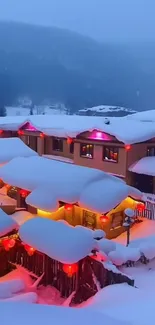 Illuminated chalet in snowy mountain landscape