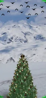 Christmas tree with snowy mountain background and flying birds.