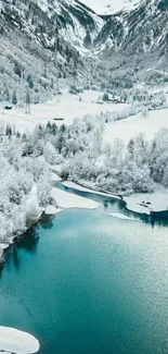 Snowy mountains and turquoise lake in winter landscape wallpaper.