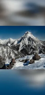 Breathtaking snowy mountain under blue sky in winter landscape.