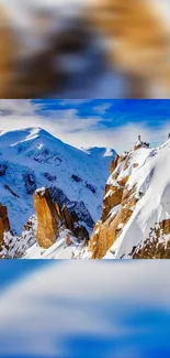 Snowy mountain peaks under a vibrant blue sky.